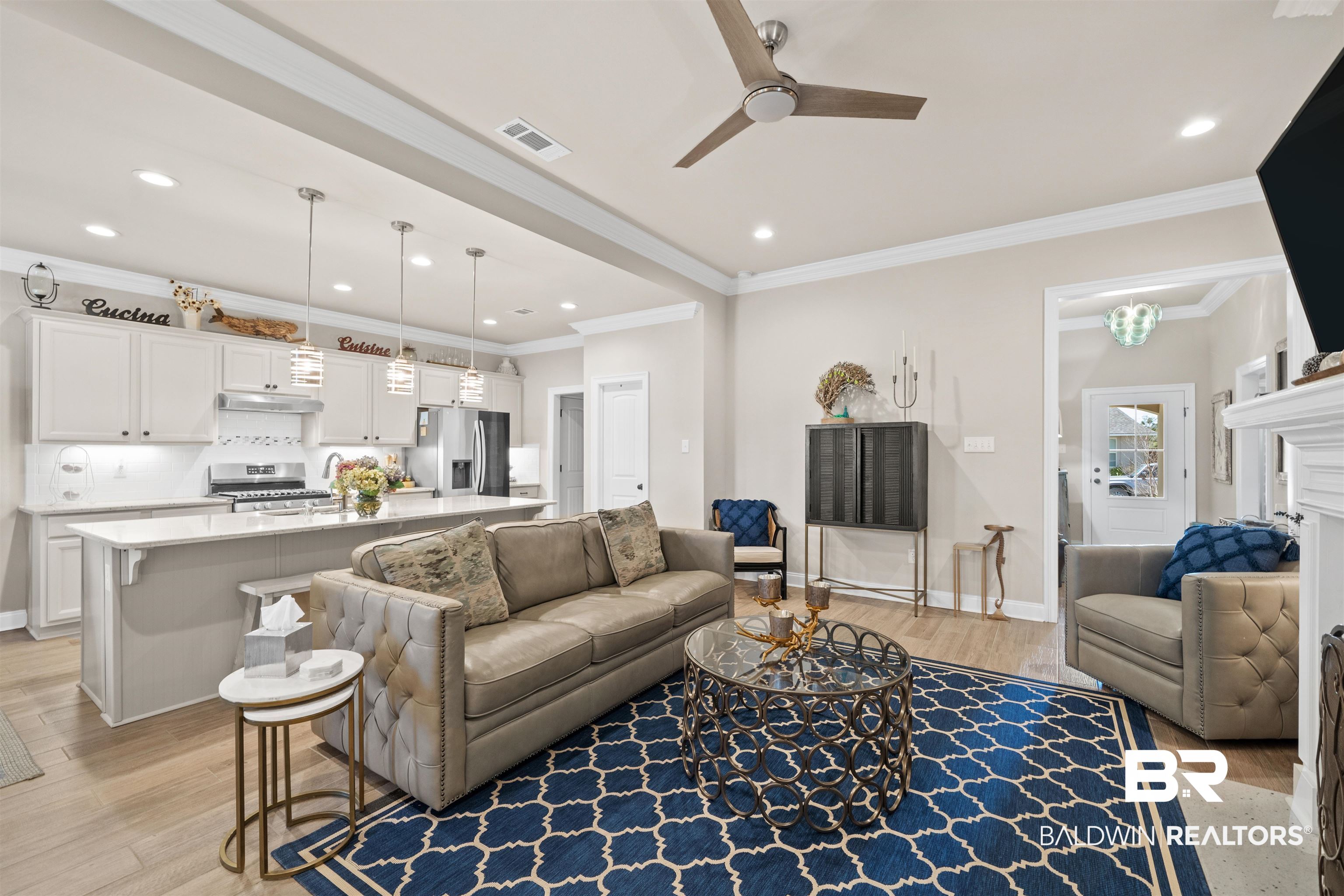 1509 Fenton Circle Foley, AL 36535 - Photo 8 of 34 Living area featuring visible vents, ornamental molding, light wood-style flooring, and ceiling fan