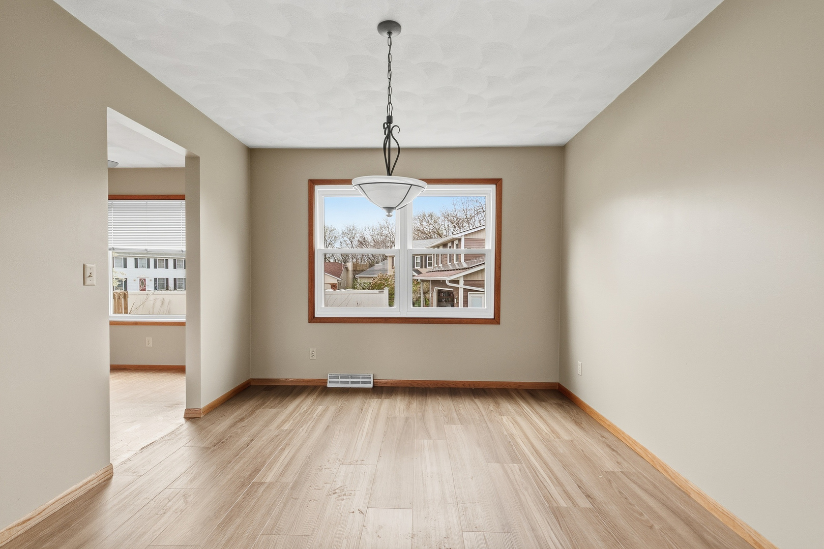 3503 32nd Street Moline, IL 61265 - Photo 11 of 32 a view of an empty room with window and wooden floor