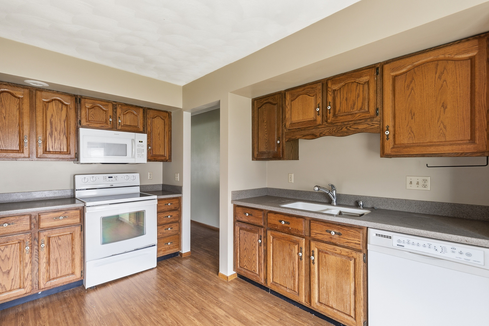 3503 32nd Street Moline, IL 61265 - Photo 13 of 32 a kitchen with stainless steel appliances granite countertop a sink stove and microwave