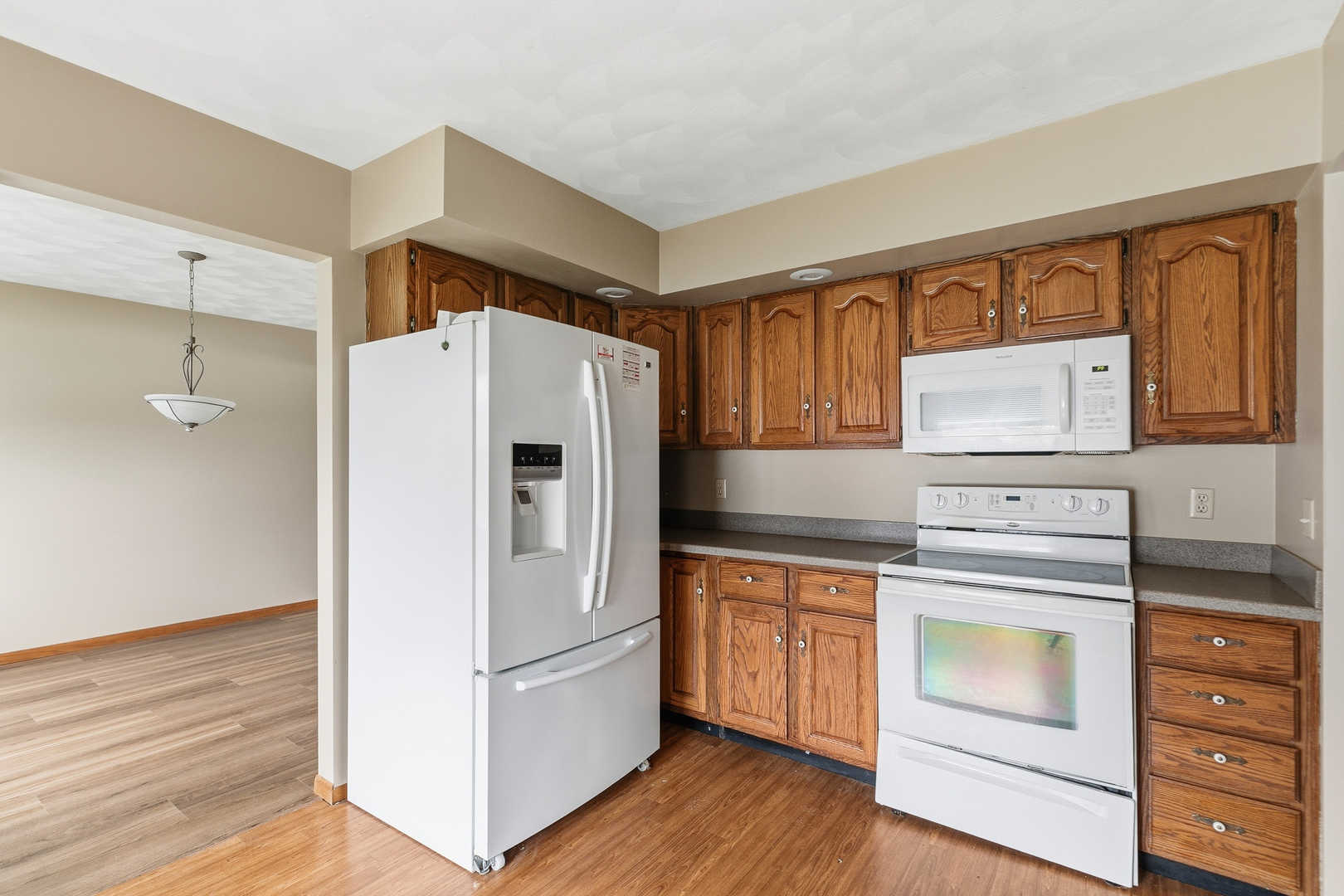 3503 32nd Street Moline, IL 61265 - Photo 14 of 32 a kitchen with a refrigerator stove and wooden cabinets