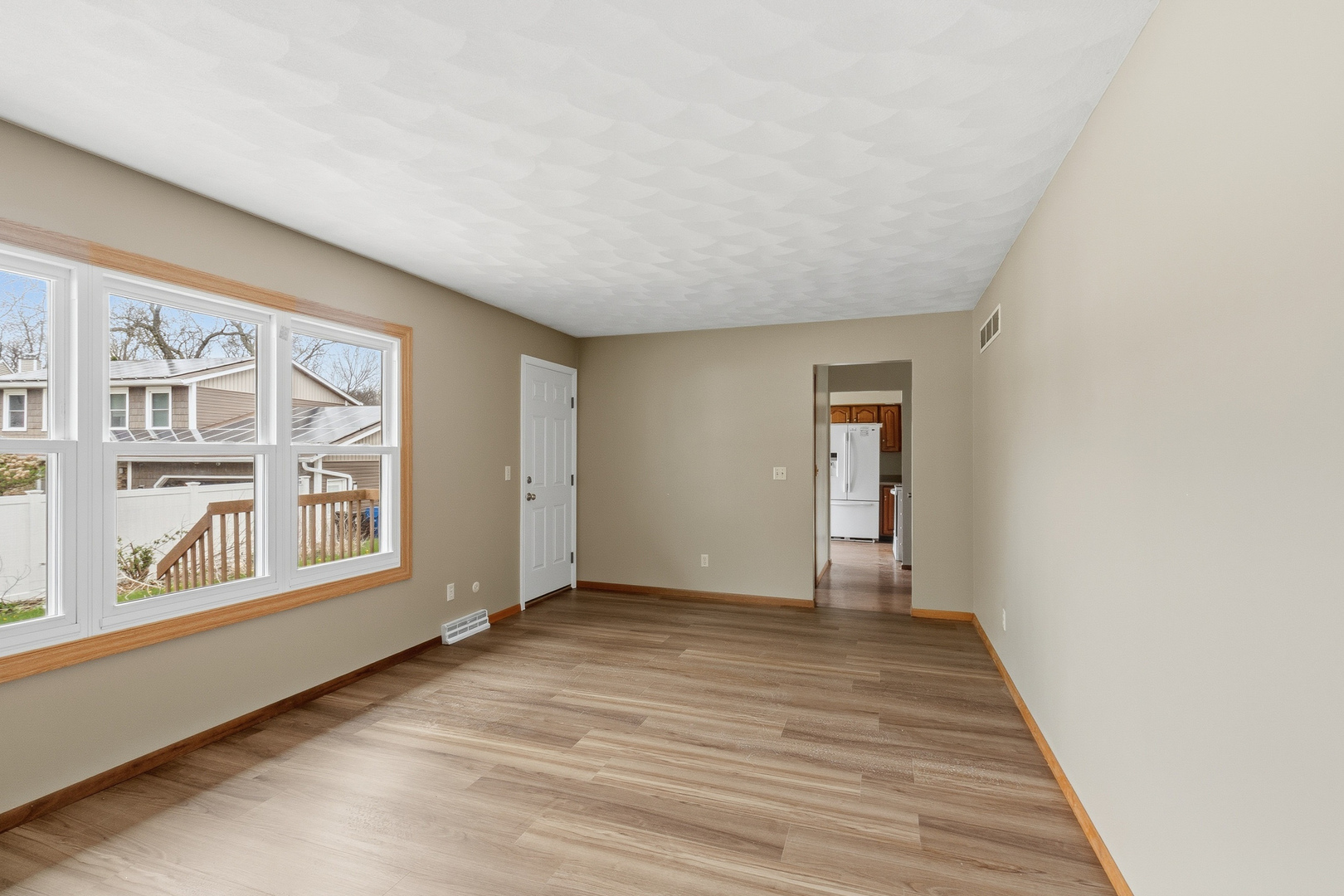 3503 32nd Street Moline, IL 61265 - Photo 17 of 32 a view of an empty room with wooden floor and a window