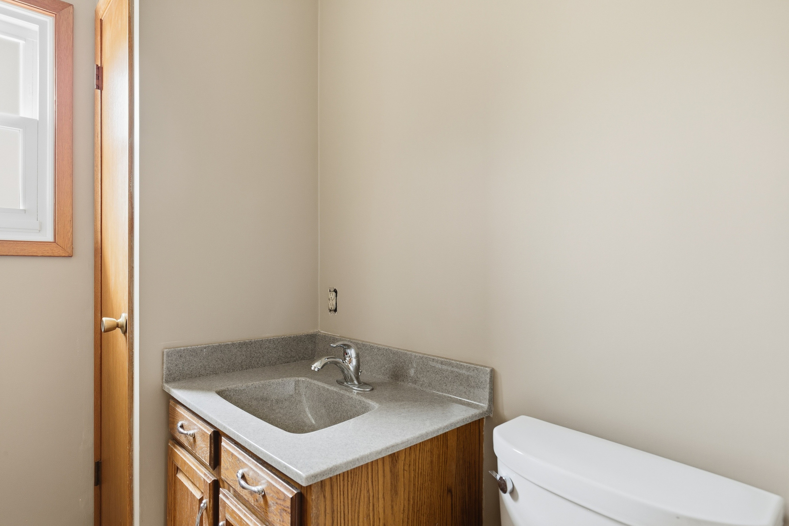 3503 32nd Street Moline, IL 61265 - Photo 18 of 32 a bathroom with a granite countertop sink and a toilet