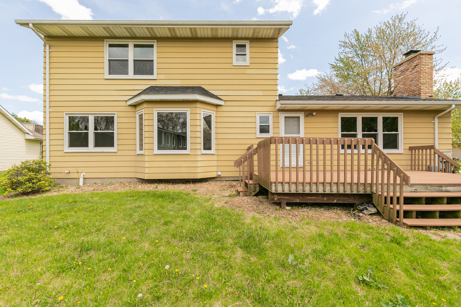 3503 32nd Street Moline, IL 61265 - Photo 4 of 32 a view of a house with a backyard and wooden fence