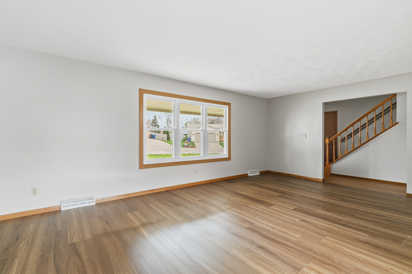 3503 32nd Street Moline, IL 61265 - Photo 10 of 32 an empty room with wooden floor and windows