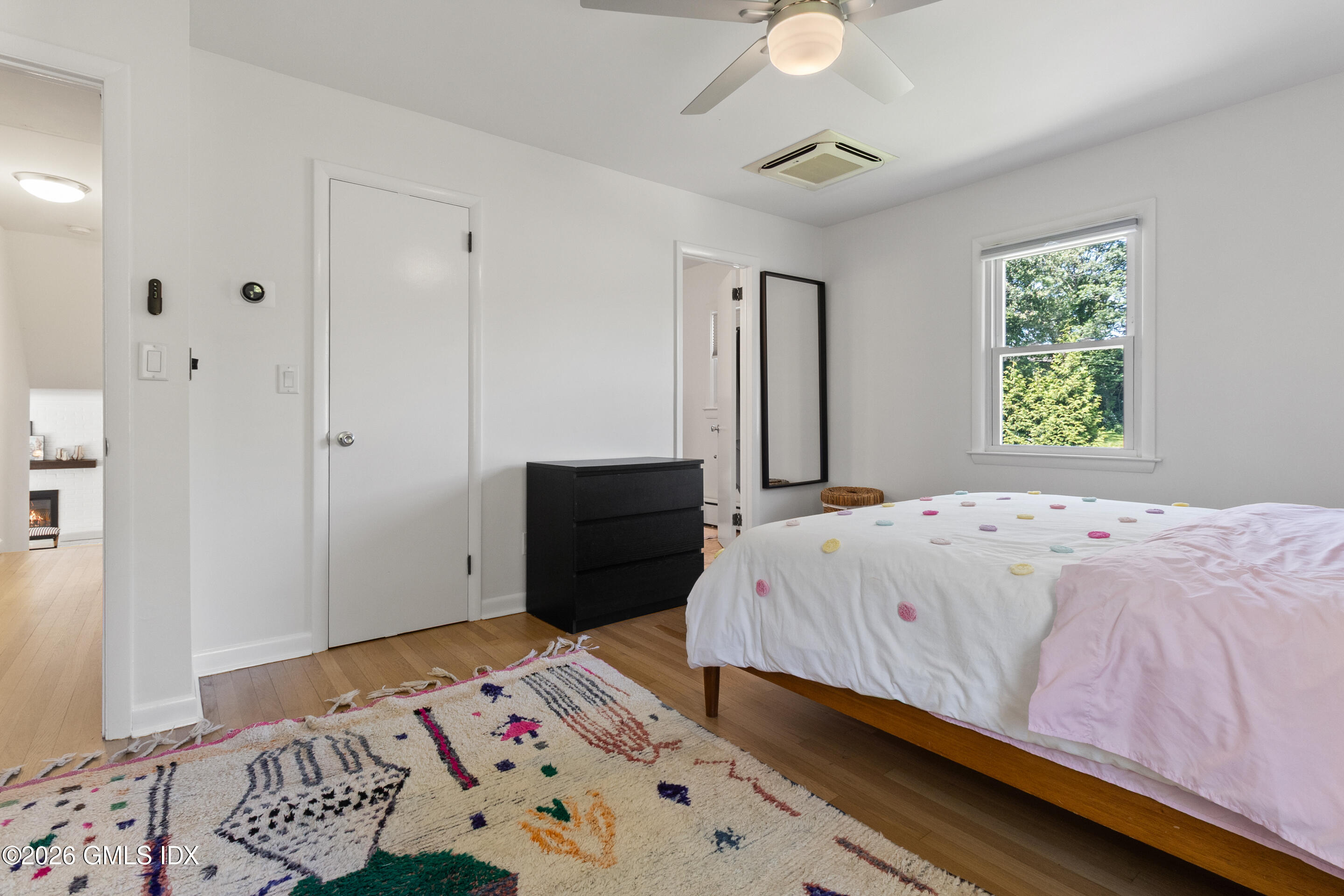 9 Deluca Drive Cos Cob, CT 06807 - Photo 19 of 30 a bedroom with a bed and a window