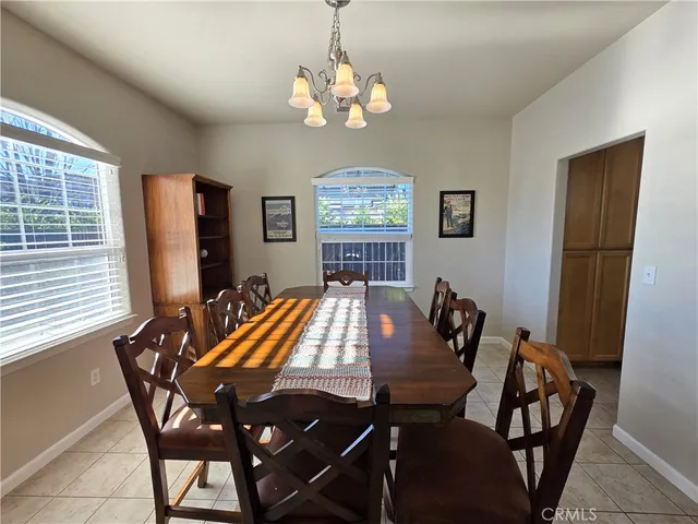 a view of a dining room with furniture and window