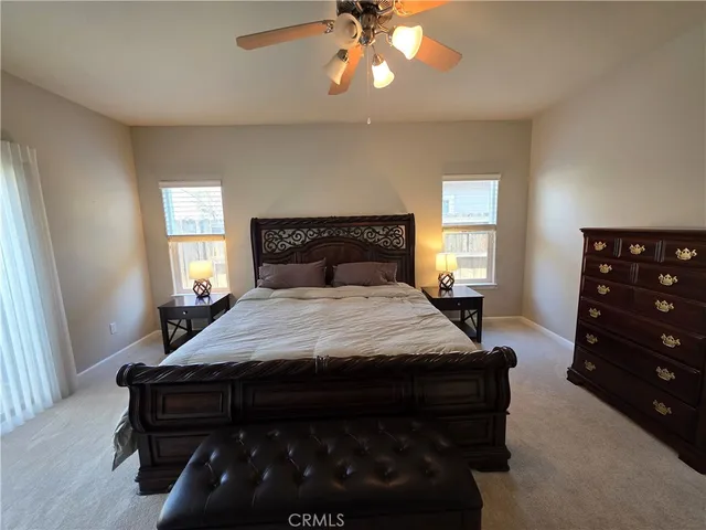 a bedroom with a bed and a dresser