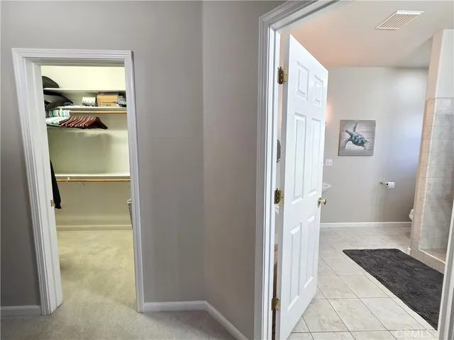 a bathroom with a glass door shower and a sink