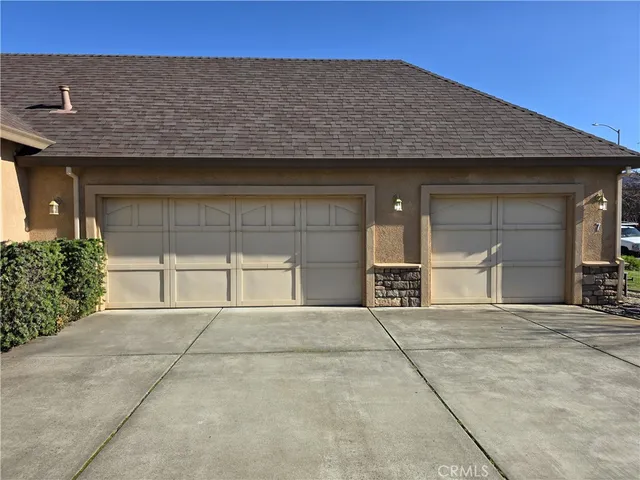a backyard of a house with yard and garage