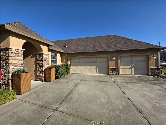 a front view of a house with a garage