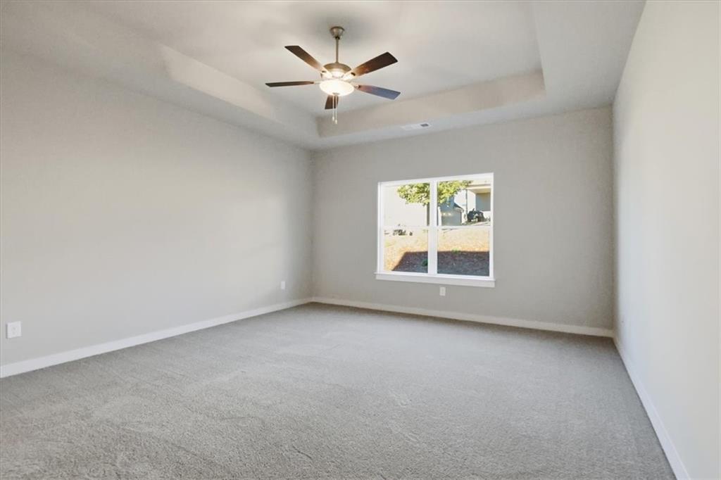 4057 Links Boulevard Jefferson, GA 30549 - Photo 27 of 58 an empty room with window and ceiling fan