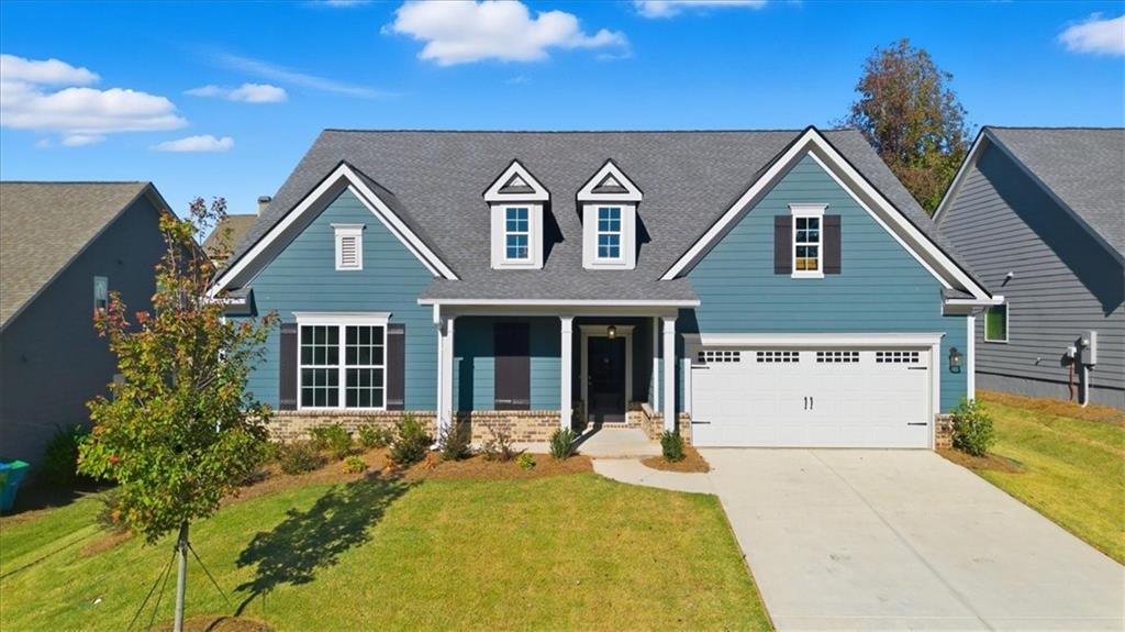 4057 Links Boulevard Jefferson, GA 30549 - Photo 3 of 58 a view of a brick house with a large windows