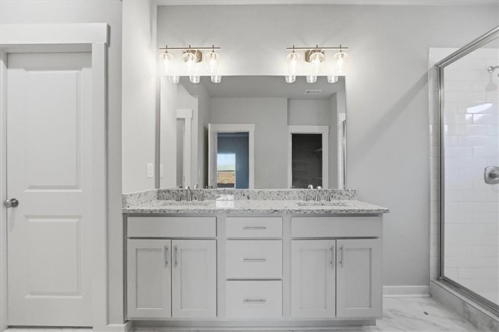 4057 Links Boulevard Jefferson, GA 30549 - Photo 32 of 58 a bathroom with a sink and a mirror