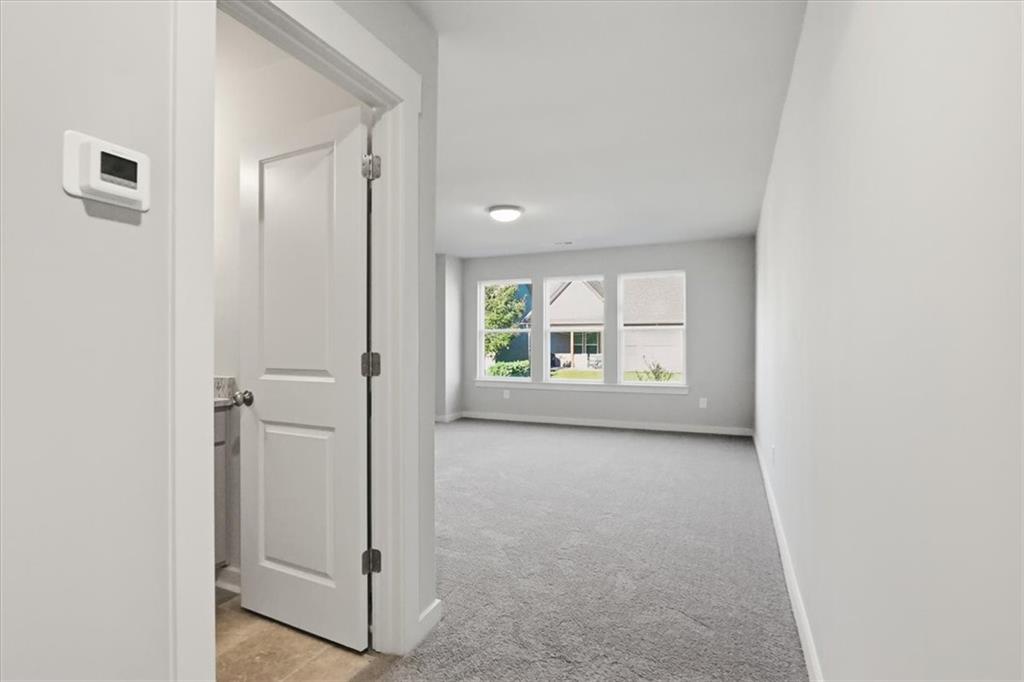 4057 Links Boulevard Jefferson, GA 30549 - Photo 41 of 58 an empty room with windows and closet