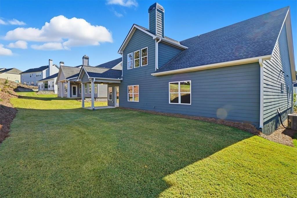 4057 Links Boulevard Jefferson, GA 30549 - Photo 50 of 58 a view of a house with a backyard