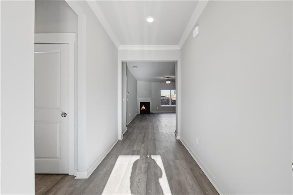 4057 Links Boulevard Jefferson, GA 30549 - Photo 5 of 58 a view of a hallway with wooden floor