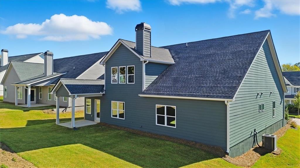 4057 Links Boulevard Jefferson, GA 30549 - Photo 54 of 58 a front view of a house with a yard