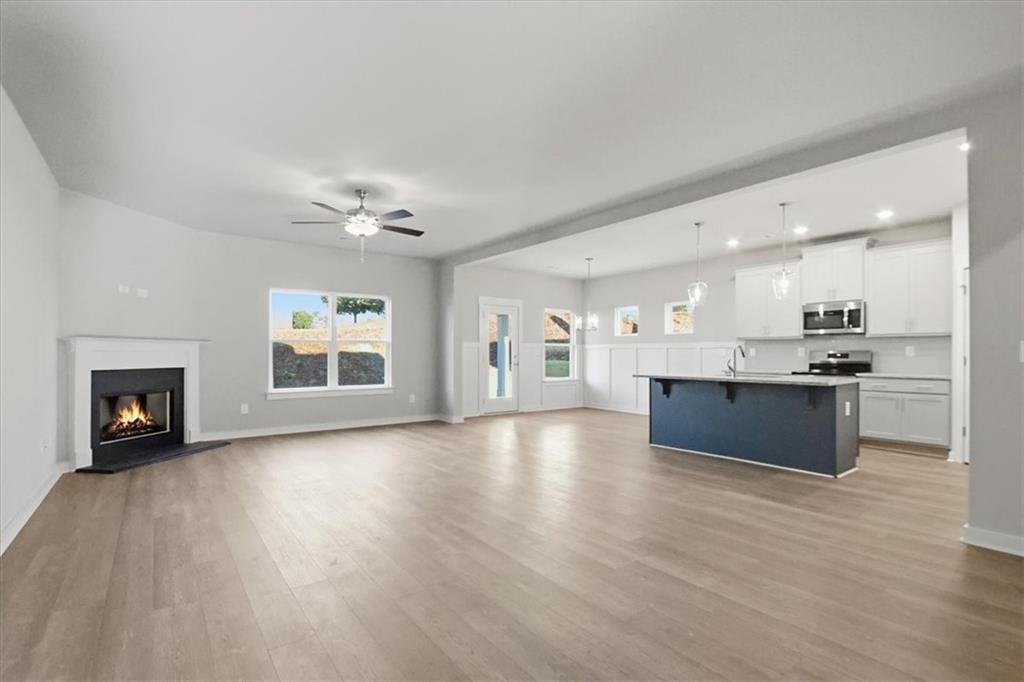 4057 Links Boulevard Jefferson, GA 30549 - Photo 7 of 58 a large kitchen with a stove top oven and refrigerator