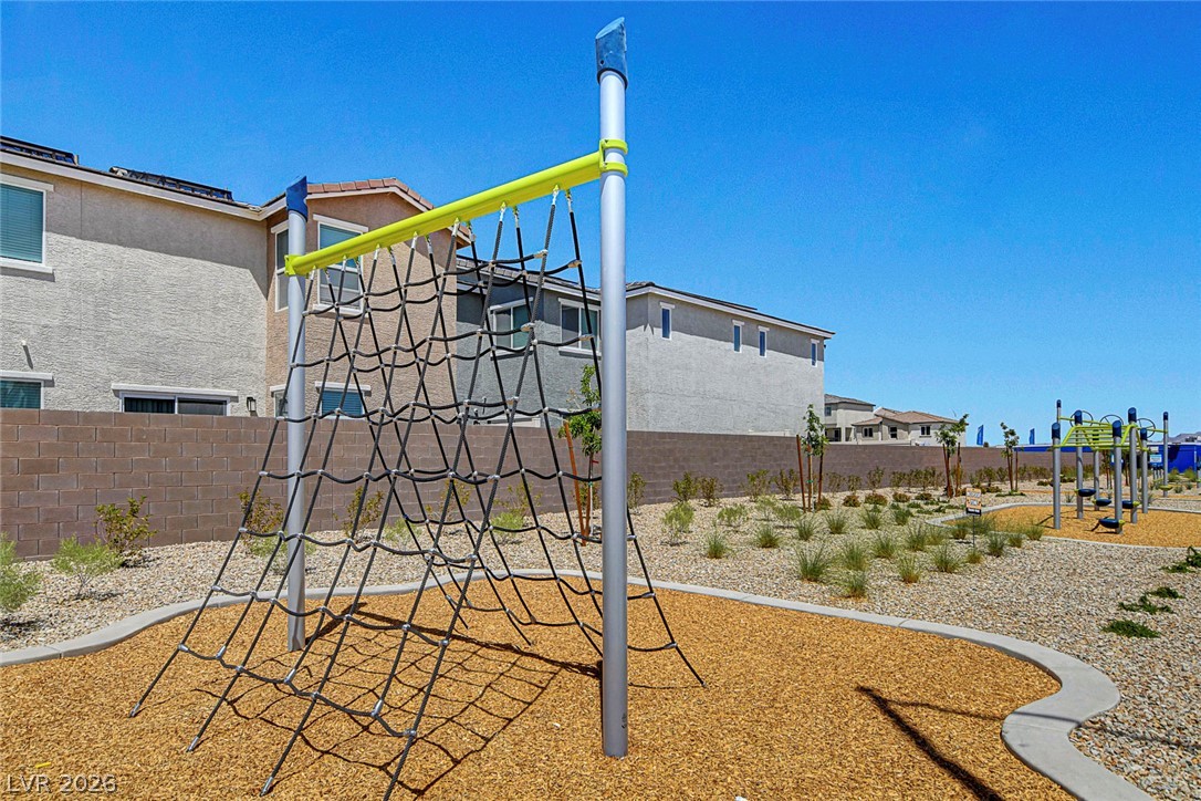 6924 Spicy Merlot Street North Las Vegas, NV 89086 - Photo 52 of 83 A vibrant neighborhood park offers children a climbing net and play structures.