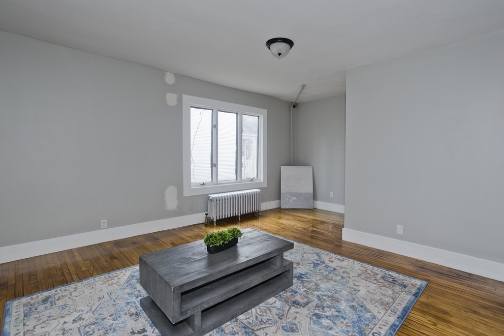 65 Montrose Street Springfield, MA 01109 - Photo 12 of 27 a living room with couch and wooden floor