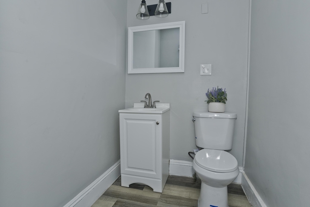 65 Montrose Street Springfield, MA 01109 - Photo 10 of 27 a white toilet sitting next to a bathroom sink