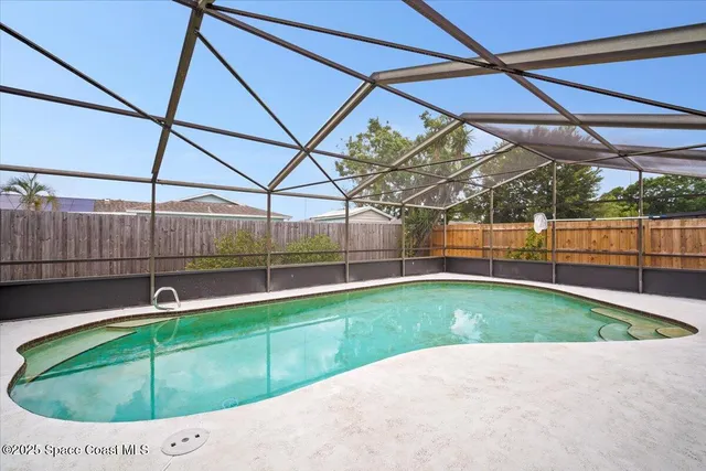 a view of yard with swimming pool