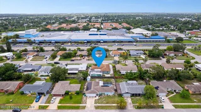an aerial view of residential houses with outdoor space