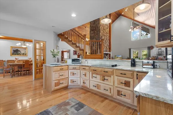 a kitchen with stainless steel appliances granite countertop a sink and cabinets
