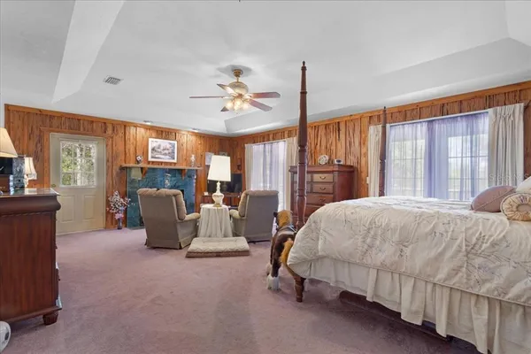 a bed room with a bed and a chair