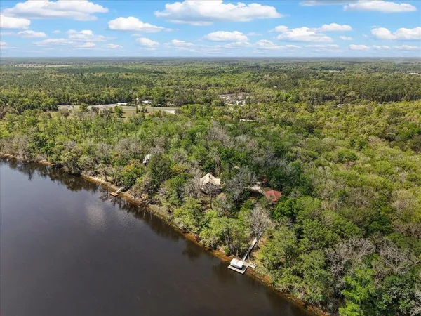 a view of a lake with houses in the back