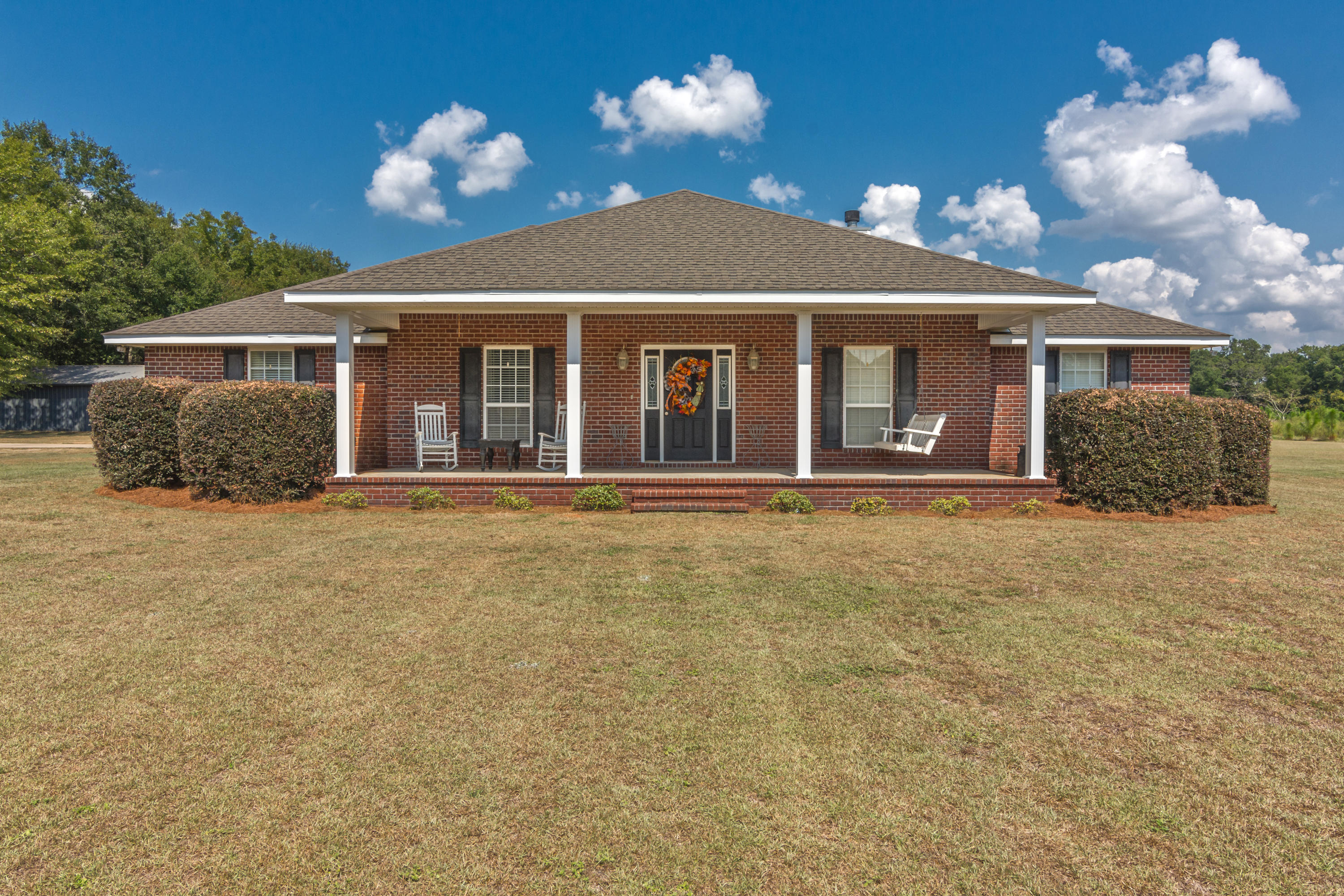 5803 Bush Road Baker, FL 32531 - Photo 1 of 34 a house view with a outdoor space
