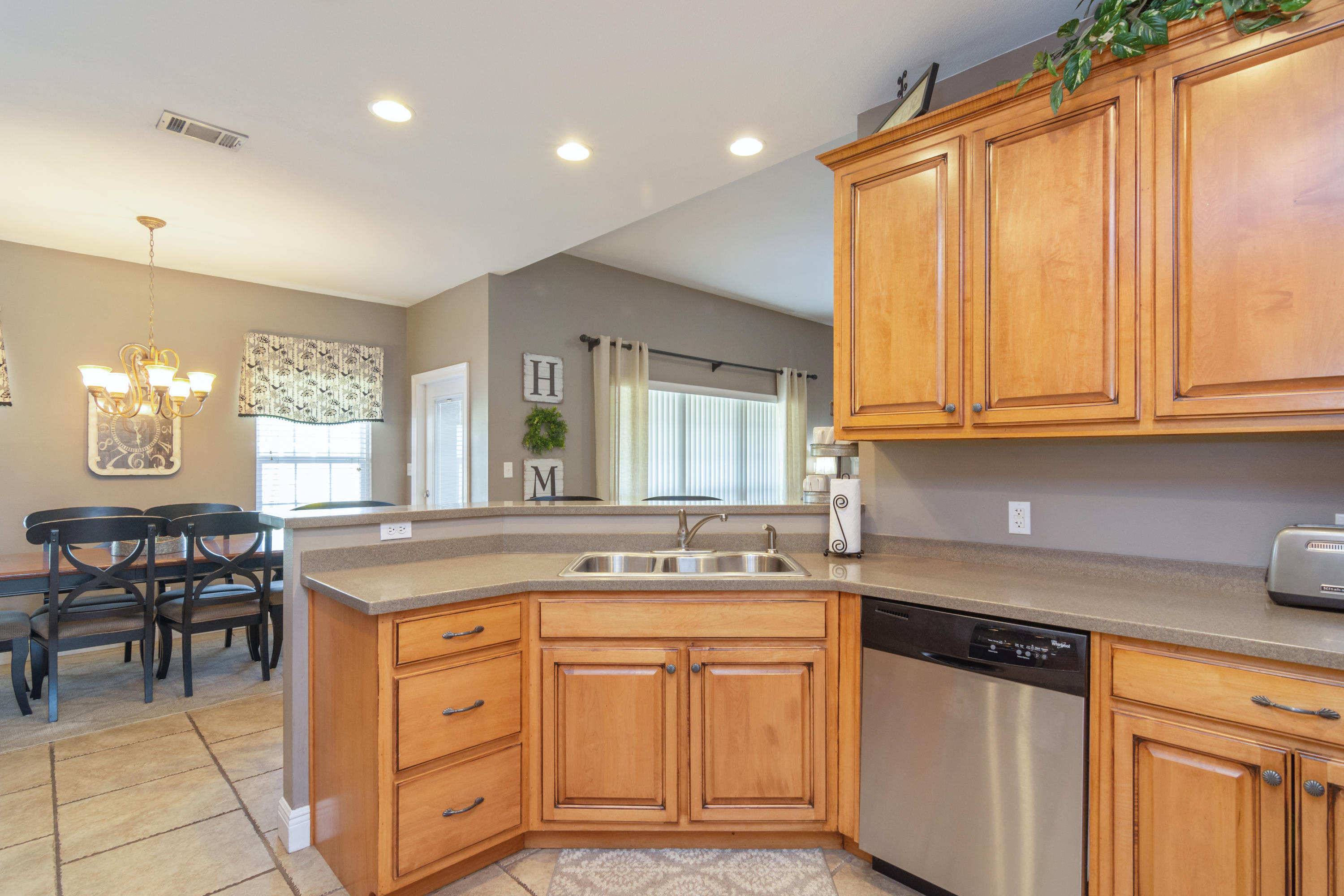5803 Bush Road Baker, FL 32531 - Photo 13 of 34 a kitchen with stainless steel appliances granite countertop a sink and cabinets