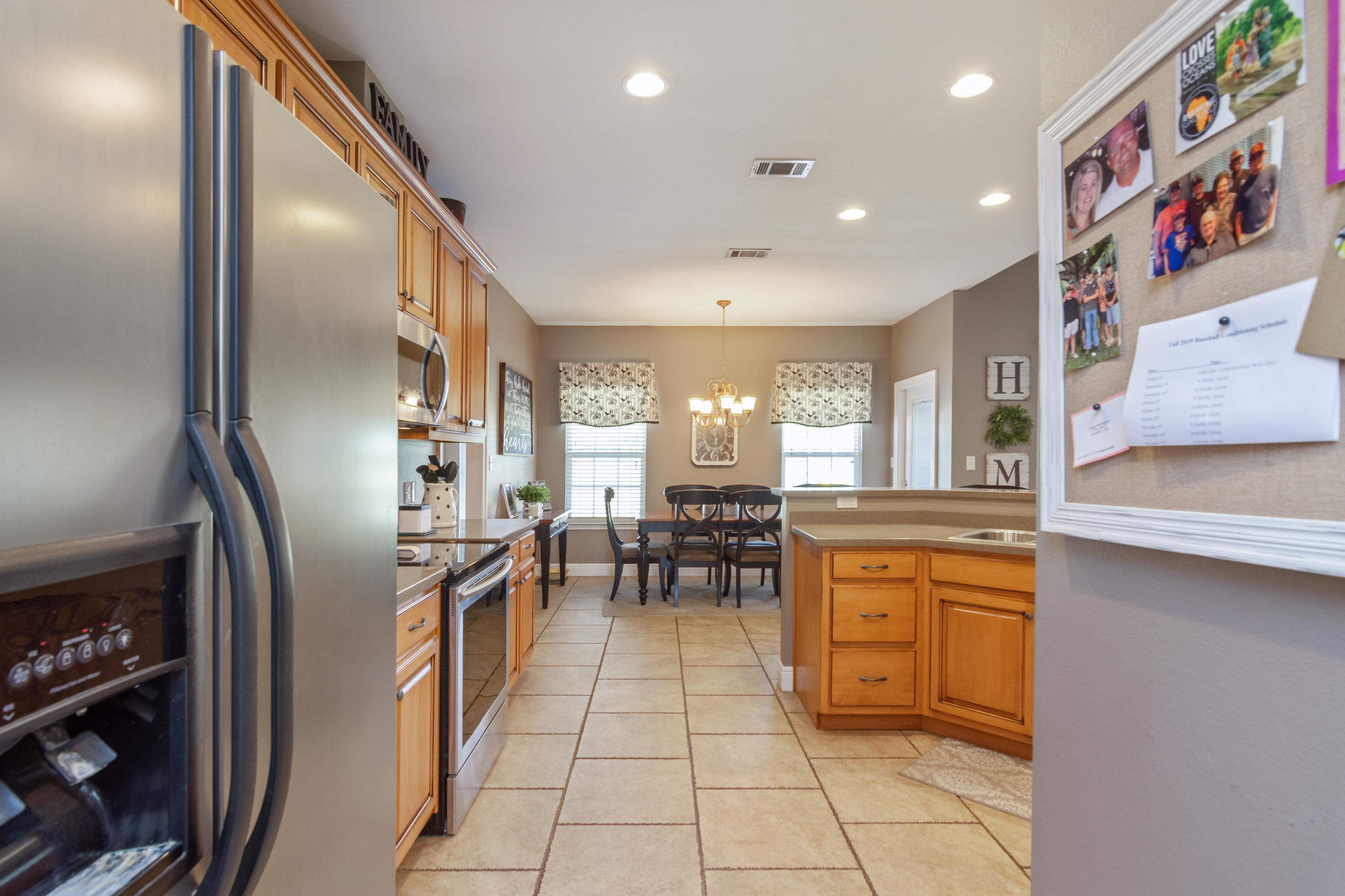 5803 Bush Road Baker, FL 32531 - Photo 14 of 34 a kitchen with stainless steel appliances granite countertop a refrigerator and a sink