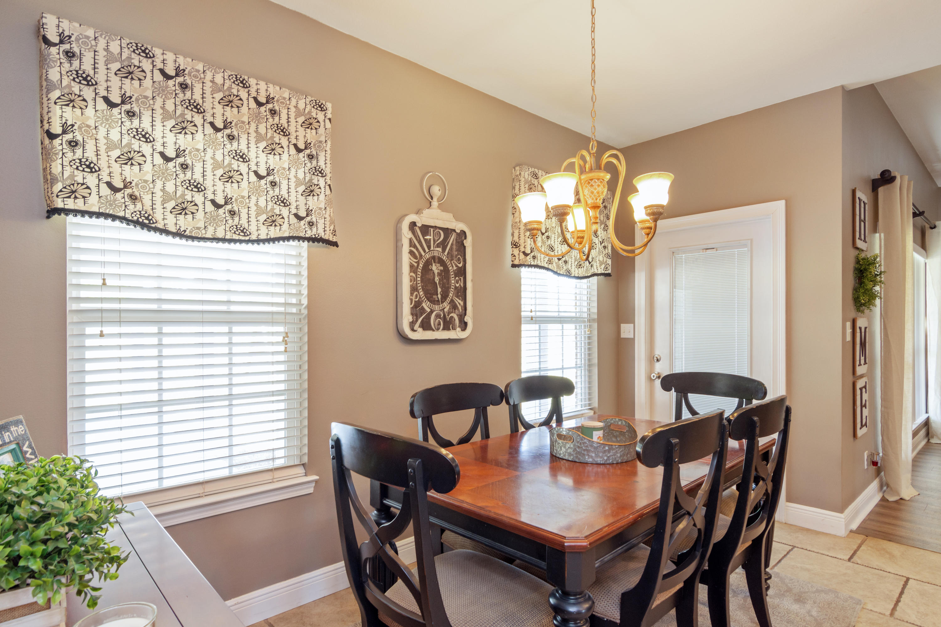 5803 Bush Road Baker, FL 32531 - Photo 16 of 34 a view of a dining room with furniture and chandelier