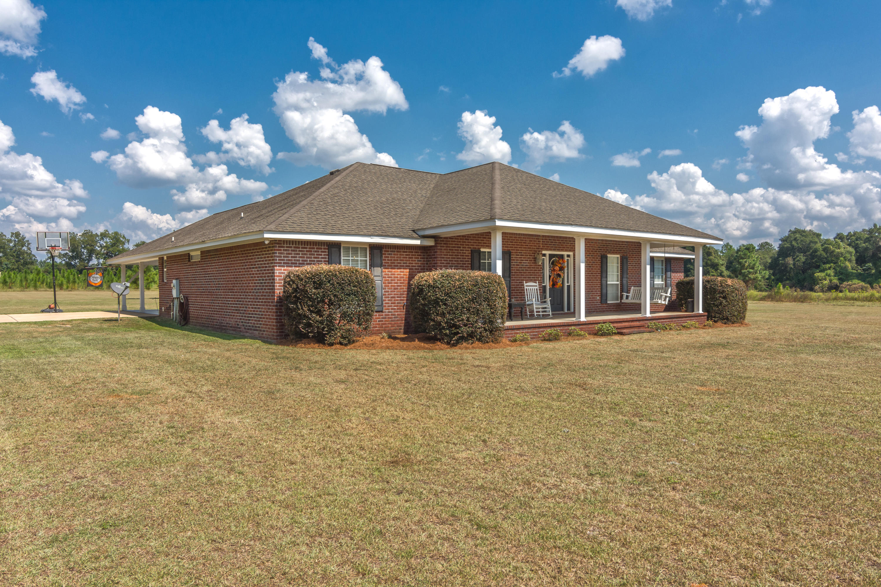 5803 Bush Road Baker, FL 32531 - Photo 3 of 34 a view of a house with a yard and potted plants