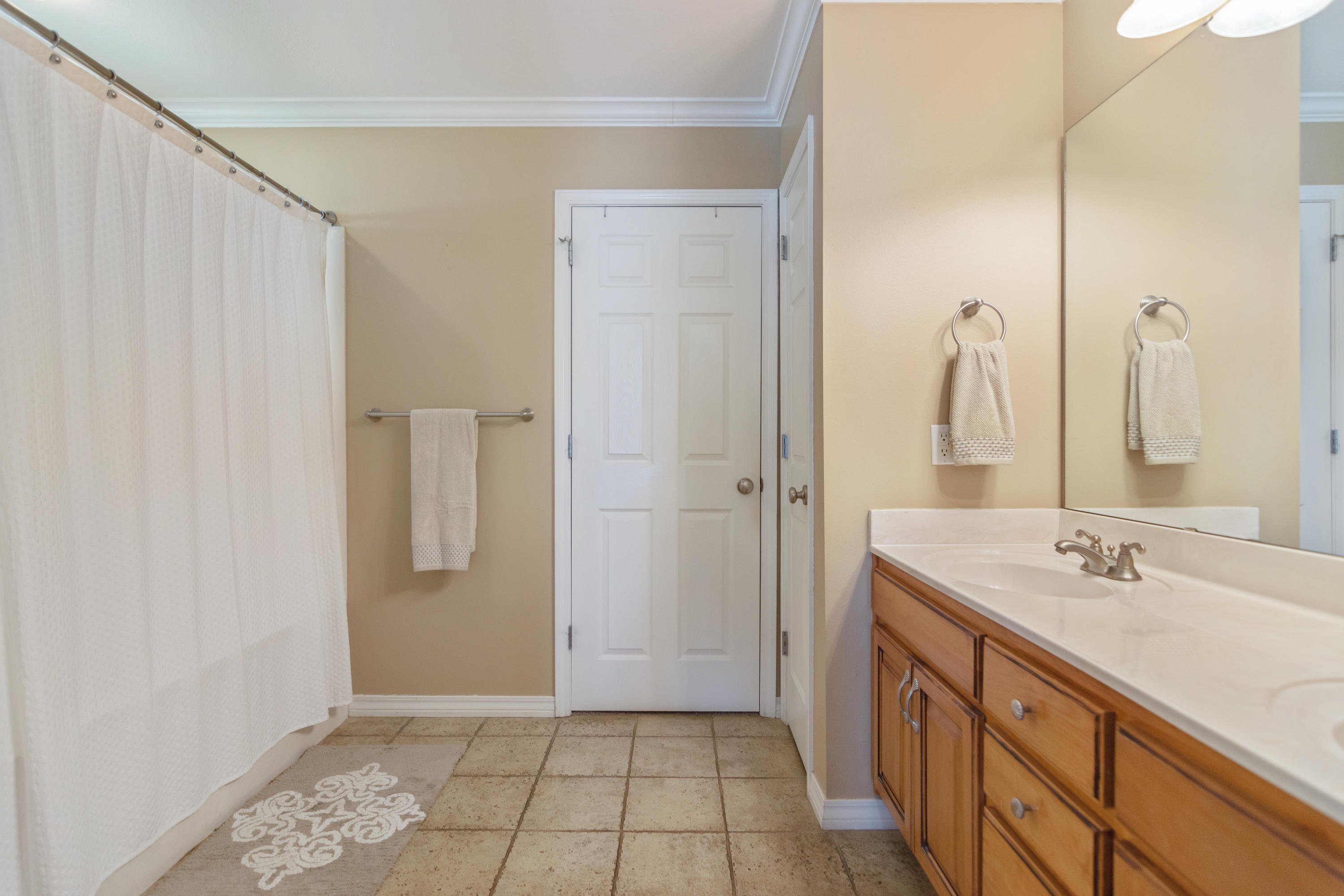 5803 Bush Road Baker, FL 32531 - Photo 21 of 34 a bathroom with a sink a mirror and a shower