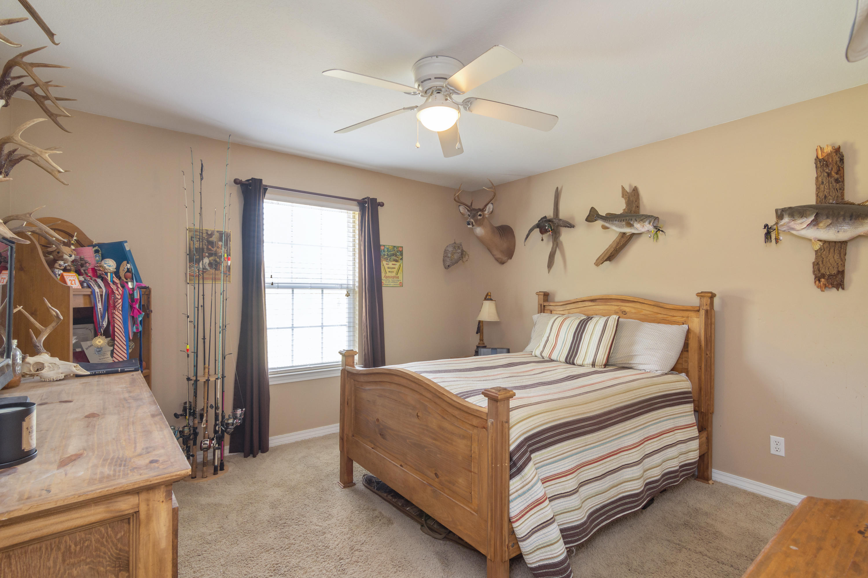 5803 Bush Road Baker, FL 32531 - Photo 26 of 34 a bedroom with a bed and a dresser