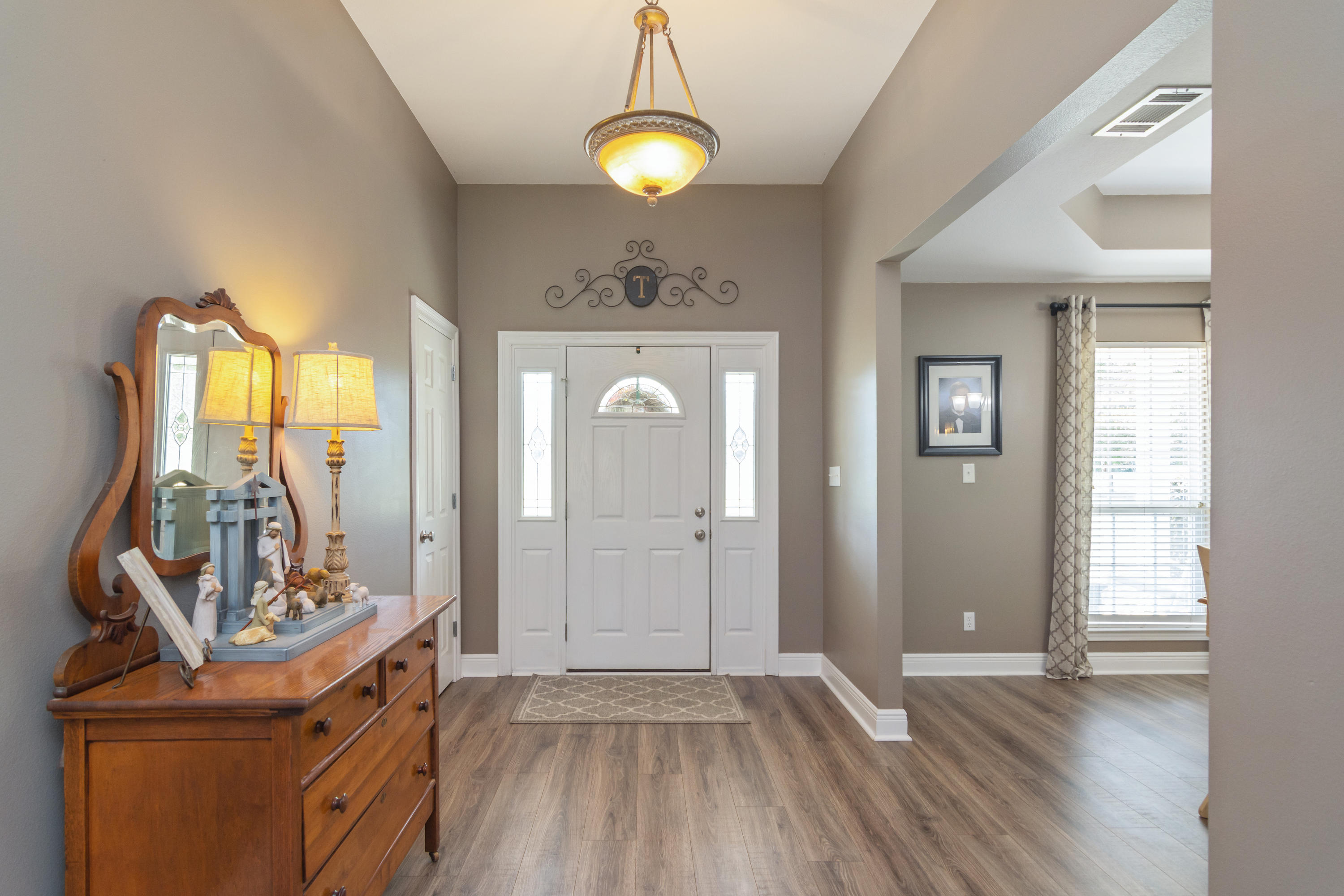 5803 Bush Road Baker, FL 32531 - Photo 5 of 34 a view of a livingroom with wooden floor and furniture