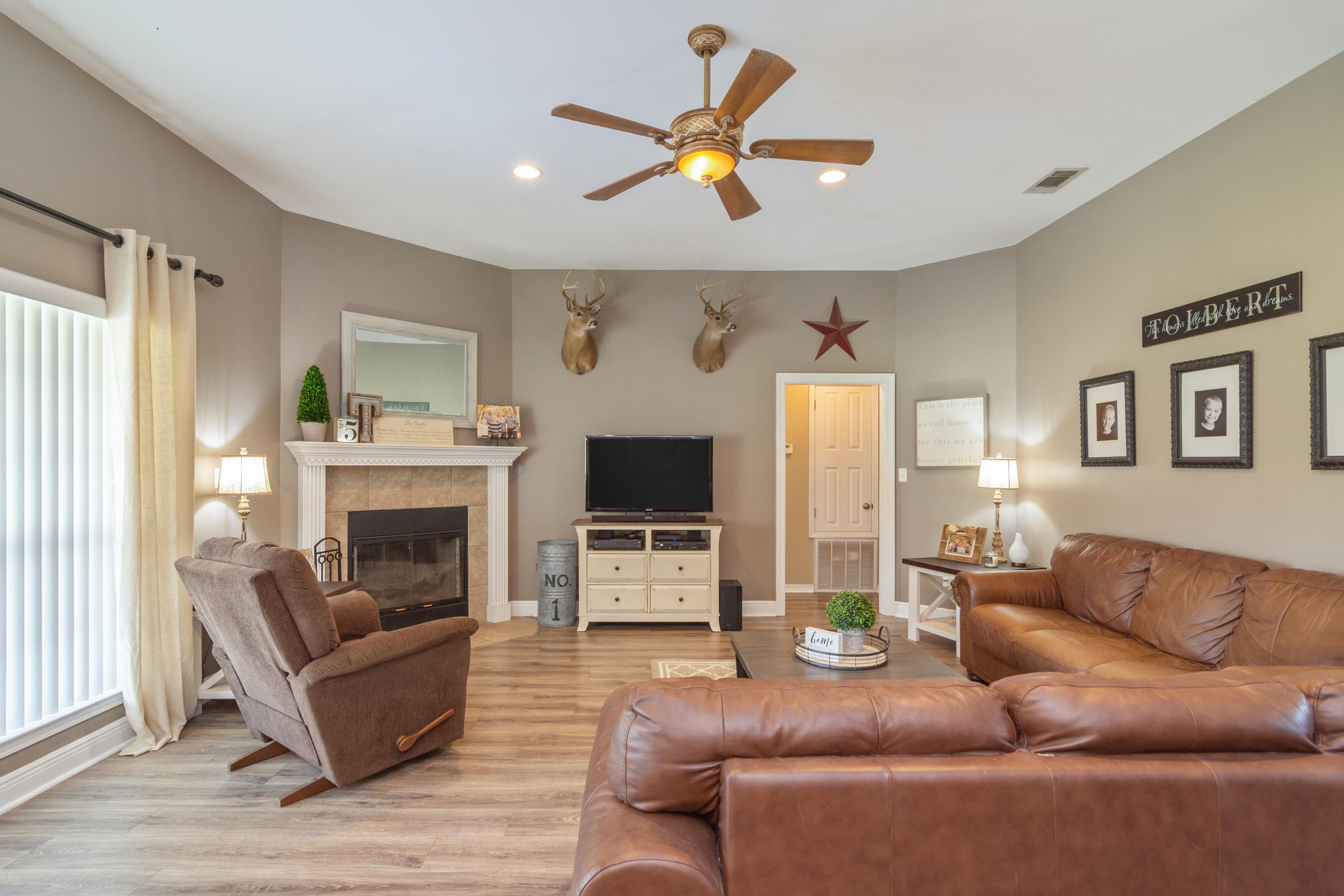 5803 Bush Road Baker, FL 32531 - Photo 7 of 34 a living room with furniture and a fireplace