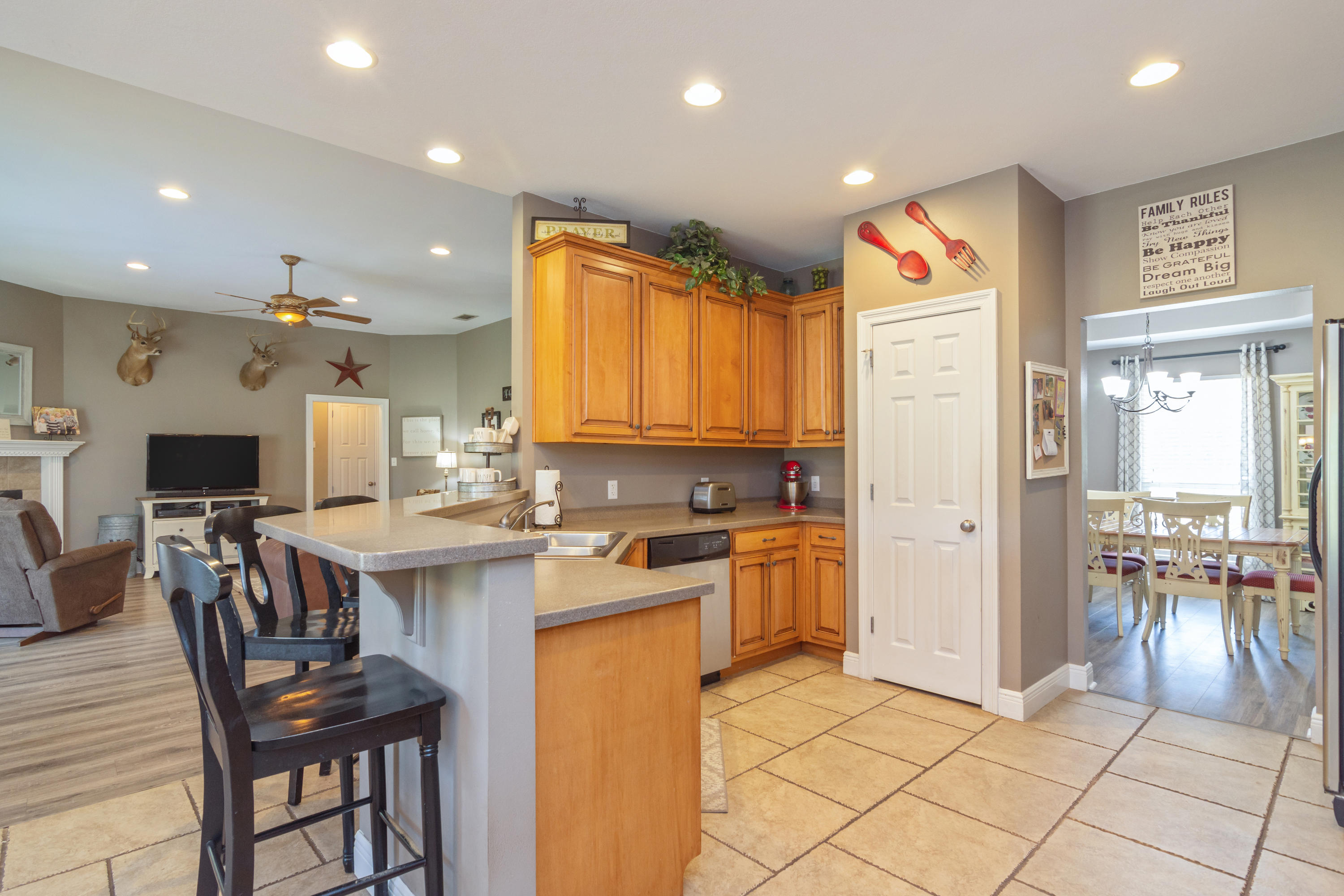 5803 Bush Road Baker, FL 32531 - Photo 10 of 34 a kitchen with stainless steel appliances granite countertop a sink and a refrigerator
