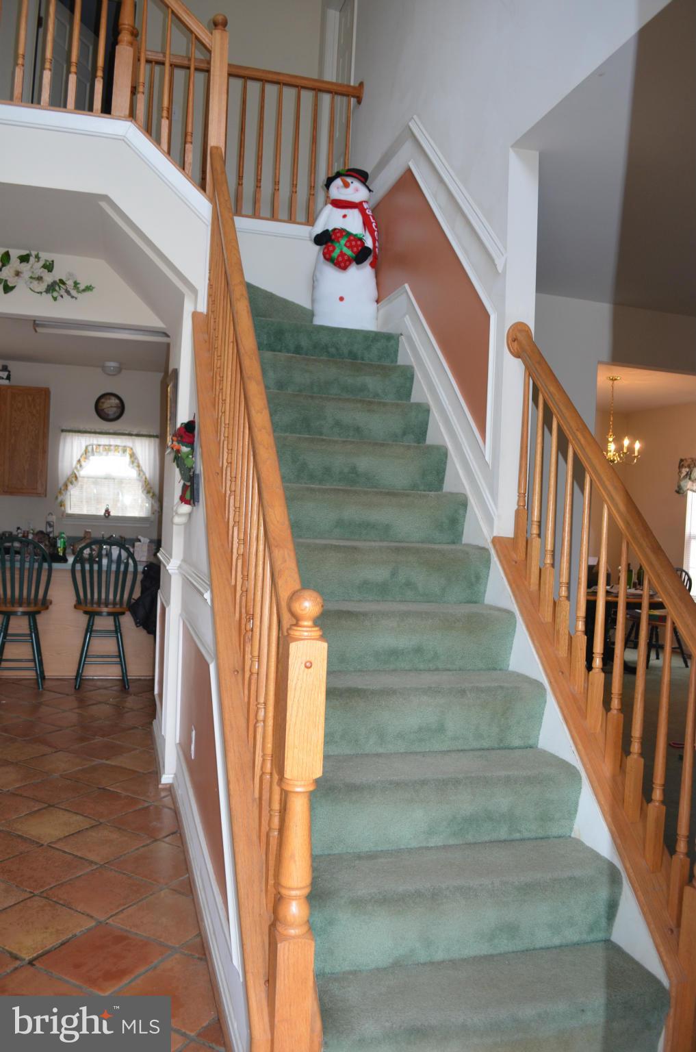4570 Mattapany Road St. Leonard, MD 20685 - Photo 4 of 28 Curved Stairway in Two-Story Foyer