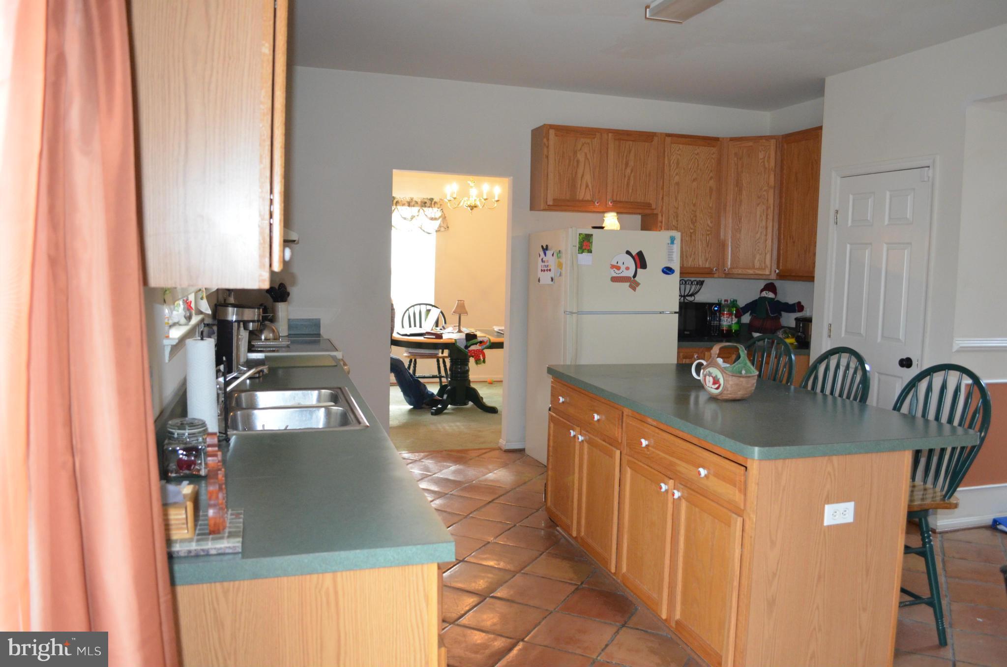 4570 Mattapany Road St. Leonard, MD 20685 - Photo 9 of 28 Kitchen has large island and tilefloor