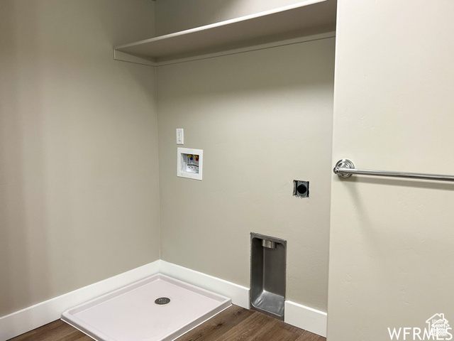 702 North 100 West Logan, UT 84321 - Photo 49 of 58 Laundry room with dark wood-style floors, electric dryer hookup, hookup for a washing machine, and laundry area