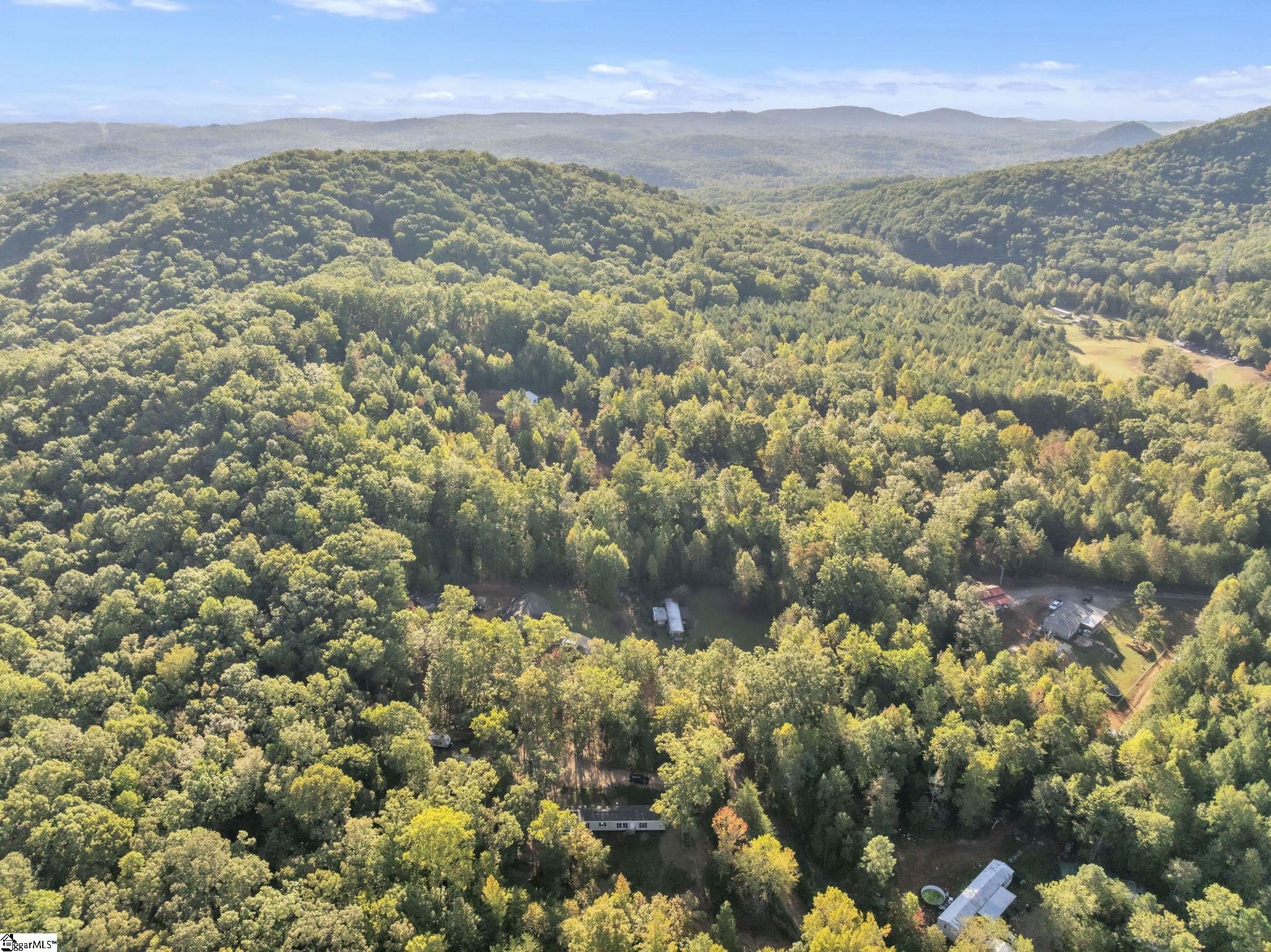 145 Bellwood Road Pickens, SC 29671 - Photo 2 of 22 Includes 1.7 acres. And BONUS- this lot backs up to hundreds of acres in a land trust.