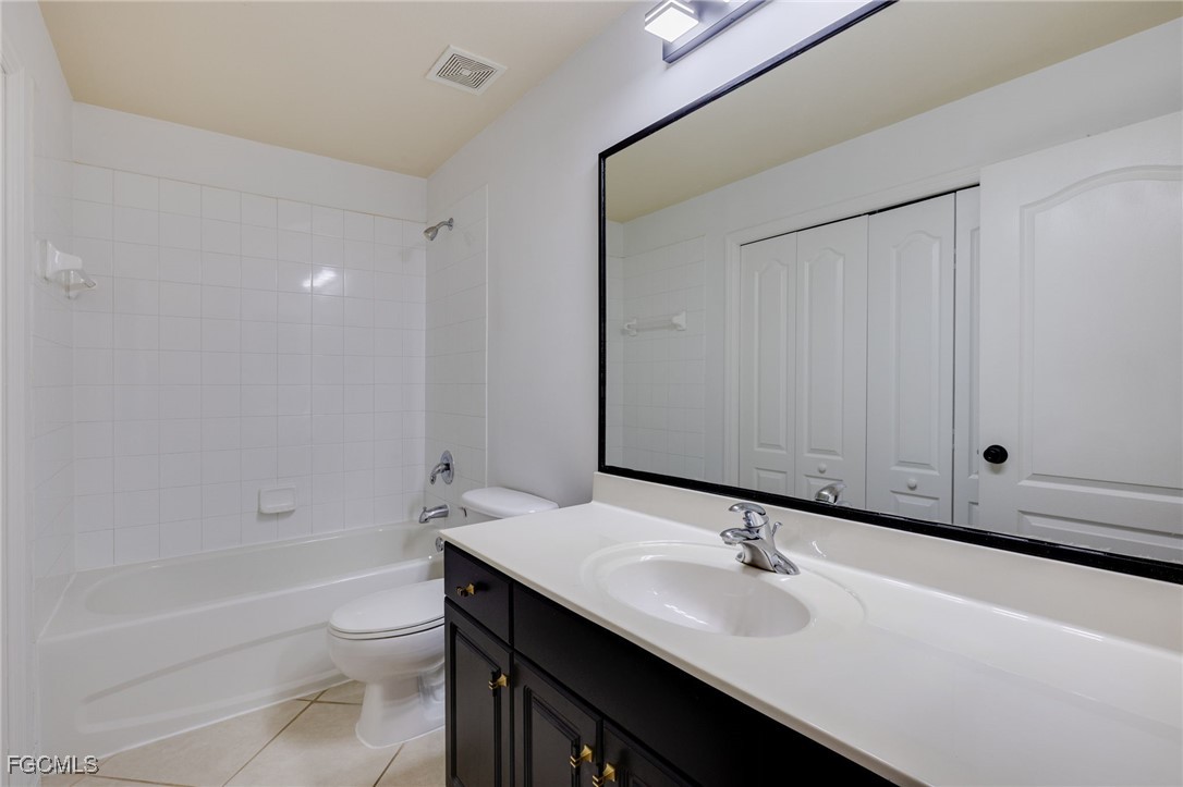 9470 Ivy Brook Run, Unit 805 Fort Myers, FL 33913 - Photo 14 of 31 a bathroom with a sink and a toilet
