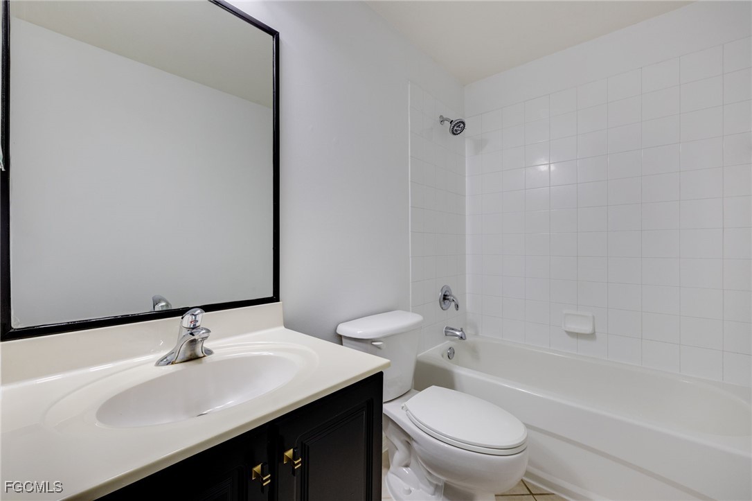 9470 Ivy Brook Run, Unit 805 Fort Myers, FL 33913 - Photo 17 of 31 a bathroom with a sink a toilet and shower