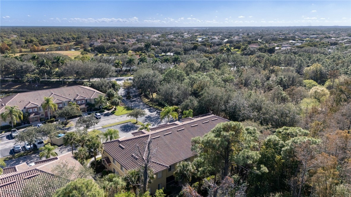 9470 Ivy Brook Run, Unit 805 Fort Myers, FL 33913 - Photo 24 of 31 an aerial view of house with yard and mountain view in back