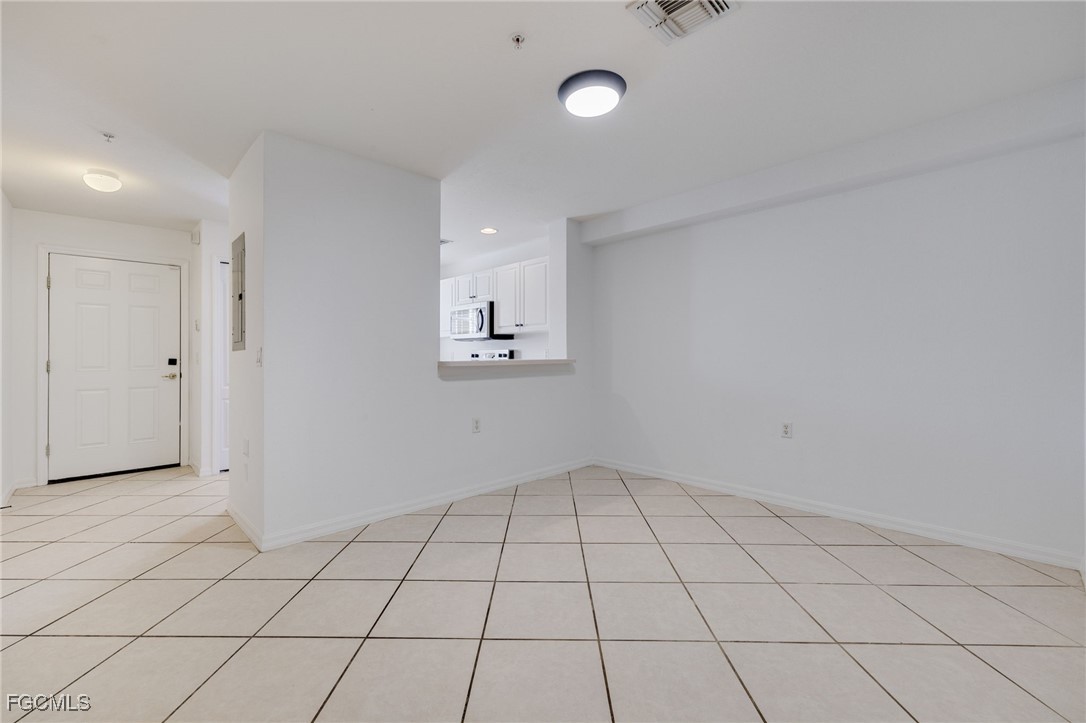 9470 Ivy Brook Run, Unit 805 Fort Myers, FL 33913 - Photo 4 of 31 a view of an empty room and window