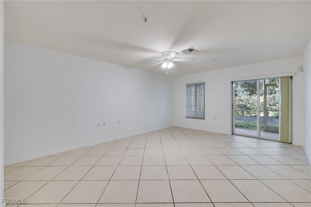 9470 Ivy Brook Run, Unit 805 Fort Myers, FL 33913 - Photo 9 of 31 a view of an empty room with a window