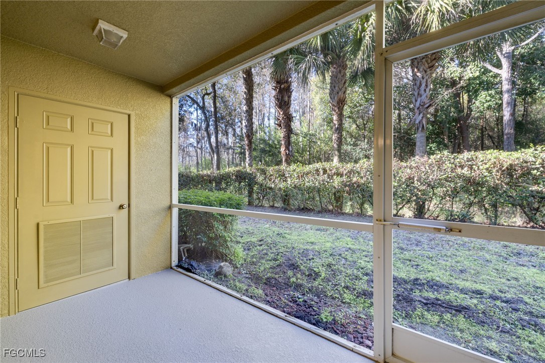 9470 Ivy Brook Run, Unit 805 Fort Myers, FL 33913 - Photo 10 of 31 a view of a room with a large window and wooden floor